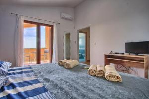 Posteľ alebo postele v izbe v ubytovaní Villa Stokovci in Central Istria for families and kids with a large garden and playground