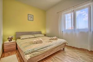 Posteľ alebo postele v izbe v ubytovaní Villa Stokovci in Central Istria for families and kids with a large garden and playground
