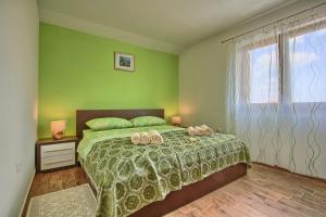 Posteľ alebo postele v izbe v ubytovaní Villa Stokovci in Central Istria for families and kids with a large garden and playground