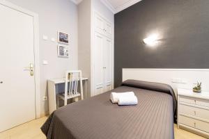 Postel nebo postele na pokoji v ubytování Hostal Ya
