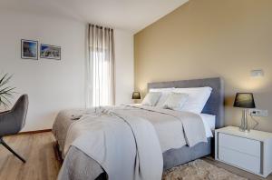 Posteľ alebo postele v izbe v ubytovaní Villa Ula in Pula with heated pool and sauna