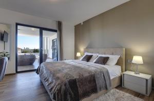 Posteľ alebo postele v izbe v ubytovaní Villa Ula in Pula with heated pool and sauna