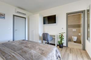 Posteľ alebo postele v izbe v ubytovaní Villa Ula in Pula with heated pool and sauna