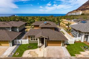 an aerial view of a house with the ocean at Aloha Breeze by AvantStay Ocean View Near Beach in Waianae
