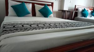 Katil atau katil-katil dalam bilik di Pearl View Guesthouse