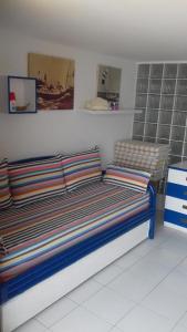 A bed or beds in a room at Marina Capo Pino