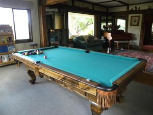 a living room with a pool table in a room at Mount Shasta Ranch Bed and Breakfast in Mount Shasta