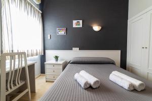 Postel nebo postele na pokoji v ubytování Hostal Ya