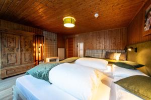 Łóżko lub łóżka w pokoju w obiekcie Panorama-Apartments Oberkofl