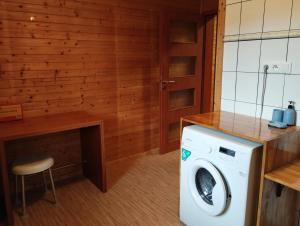 Kuchyňa alebo kuchynka v ubytovaní Apartmán v dřevěném domě