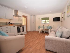 a kitchen and living room with a couch and a table at 2 Bed in Bristol 75697 in Bristol