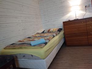 Posteľ alebo postele v izbe v ubytovaní Apartmán v dřevěném domě