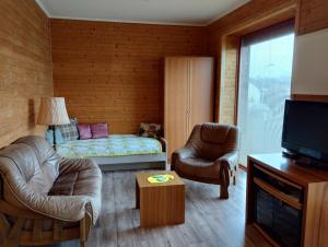 Кровать или кровати в номере Apartmán v dřevěném domě