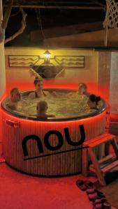 a group of people in a hot tub at Casa Mea in Eforie Nord