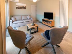 A seating area at Duplex Apartment in the shopping street of Maasmechelen