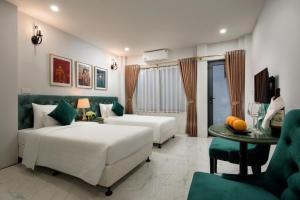 Ліжко або ліжка в номері Gatsby Central Hotel Hanoi