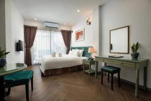 Ліжко або ліжка в номері Gatsby Central Hotel Hanoi