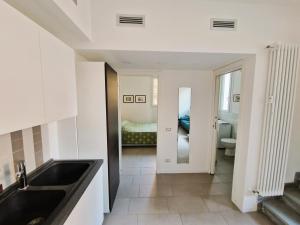 a kitchen with a sink and a bathroom at MonteRoom-Apartments in Bologna