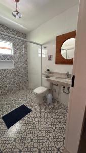 Et badeværelse på Aconchego Familiar Apartamento a 3 min do Centro