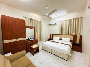 Postel nebo postele na pokoji v ubytování Bahla Jewel Hotel Apartments