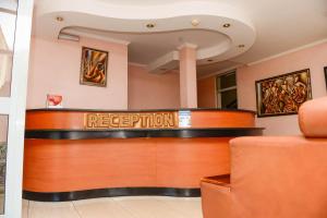 a lobby with a reception desk in a hospital at Room in BB - This Twin room is a wandeful selection in Kigali