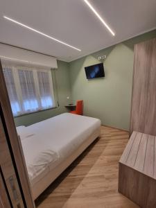 Posteľ alebo postele v izbe v ubytovaní Hotel Calypso