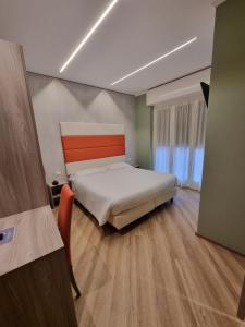 Posteľ alebo postele v izbe v ubytovaní Hotel Calypso
