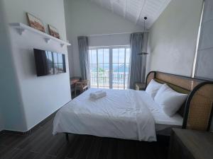 Ένα ή περισσότερα κρεβάτια σε δωμάτιο στο Seamoni Seaview Villa 01 - Novaworld Phan Thiết +26 φωτογραφίες