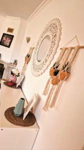a room with a wall with a mirror and potted plants at Villa Carpe Diem (Seize the day) in Carvoeiro