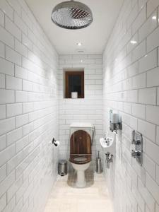 a bathroom with a toilet and a sink at Luxury Chateau w. pool & hot tub in Dordogne in Cazenac