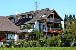 a large house with balconies on the side of it at Ferienwohnungen Martin Lafar in Öhningen