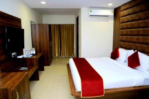 Ένα ή περισσότερα κρεβάτια σε δωμάτιο στο Pineberry Hotels - Near Golden Temple