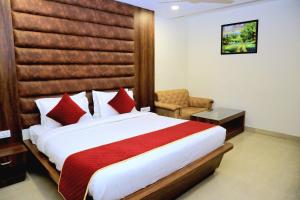 Ένα ή περισσότερα κρεβάτια σε δωμάτιο στο Pineberry Hotels - Near Golden Temple