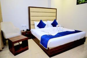 Ένα ή περισσότερα κρεβάτια σε δωμάτιο στο Pineberry Hotels - Near Golden Temple