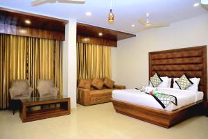Ένα ή περισσότερα κρεβάτια σε δωμάτιο στο Pineberry Hotels - Near Golden Temple