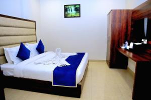 Ένα ή περισσότερα κρεβάτια σε δωμάτιο στο Pineberry Hotels - Near Golden Temple