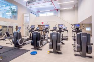 a gym with treadmills and elliptical machines at Midtown West 2br w gym roofdeck nr Hudson NYC-1395 in New York