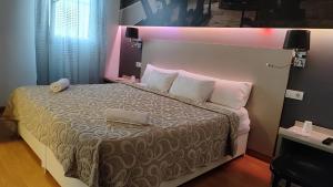 Postel nebo postele na pokoji v ubytování Hello Villarreal Suites