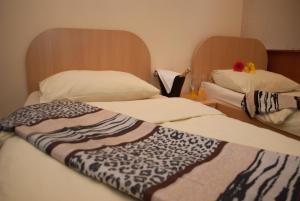 Postel nebo postele na pokoji v ubytování Hostel Fortuna