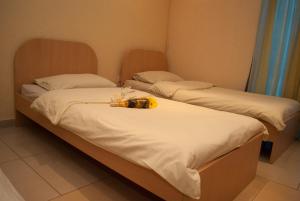 Postel nebo postele na pokoji v ubytování Hostel Fortuna