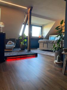 a bedroom with a bed and a red light on the floor at private Wellness Suiten mit Whirlpool in Essen