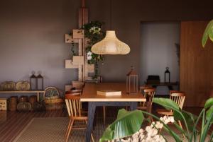a dining room with a table and chairs at Poggio Cagnano in Manciano