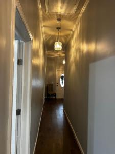 an empty hallway with a hallwayngth at Country Club in Wadley