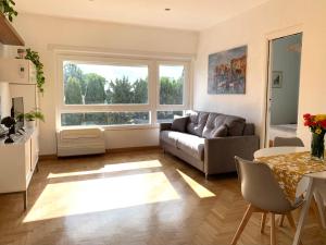 a living room with a couch and a table at Aurelia Garden in Rome