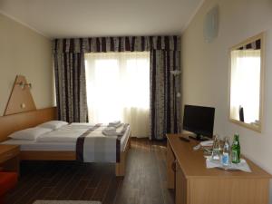 Posteľ alebo postele v izbe v ubytovaní Sástó Hotel