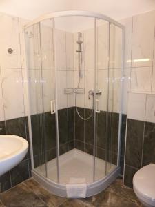 Kúpeľňa v ubytovaní Sástó Hotel