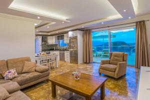 a living room with a couch and a table at Villa Mono / Kalkan in Kas