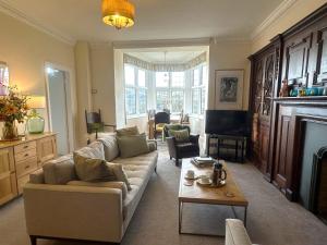 a living room with a couch and a fireplace at 3 Bed in Hawkshead 88985 in Near Sawrey