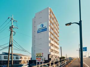 a building with a sign on the side of it at intro vetta 1002 Free Private sauna in Kumamoto