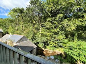 an overhead view of a fence and trees at 1 Bed in Exmoor National Park 89766 in Parracombe